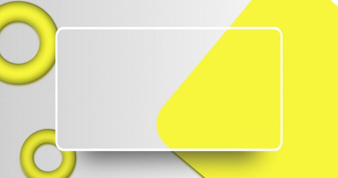 Abstract rotating and floating geometrical shape with rectangle copy space in center. Animated White color background of yellow color torus and rounded square shapes.