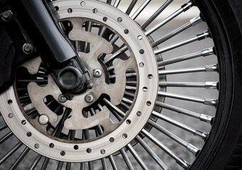 Motorbike front wheel close-up, outdoor on street. bike riding. Close up front wheel of a motorcycle.