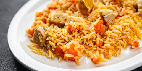 rice with meat tasty pilaf with fresh pork meat healthy eating cooking appetizer meal food snack on the table copy space