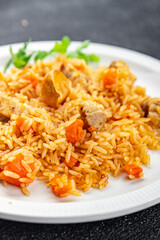 rice with meat tasty pilaf with fresh pork meat healthy eating cooking appetizer meal food snack on the table copy space