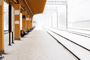 Train station in a snowstorm close up - obrazy, fototapety, plakaty