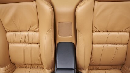 Arm rest and speaker in a car