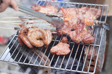 Asian, American and African family parties with grilled seafood and beer drinks, BBQ