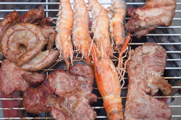Asian, American and African family parties with grilled seafood and beer drinks, BBQ