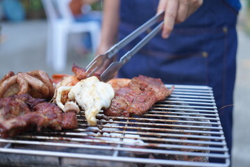 Asian, American and African family parties with grilled seafood and beer drinks, BBQ