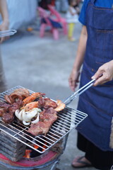 Asian, American and African family parties with grilled seafood and beer drinks, BBQ