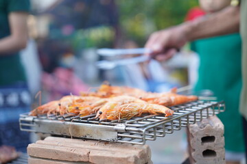 Asian, American and African family parties with grilled seafood and beer drinks, BBQ