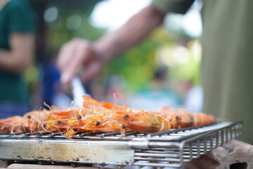 Asian, American and African family parties with grilled seafood and beer drinks, BBQ