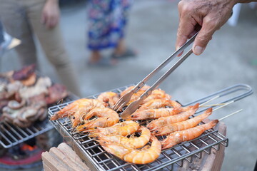 Asian, American and African family parties with grilled seafood and beer drinks, BBQ
