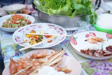 Asian, American and African family parties with grilled seafood and beer drinks, BBQ