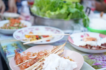 Asian, American and African family parties with grilled seafood and beer drinks, BBQ
