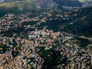 Genoa aerial view before landing to airport by airplane during a sea storm tempest hurricane