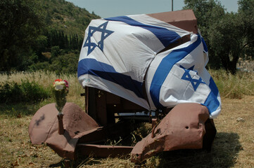 Israeli flags honor destroyed vehicles from the War of Independence