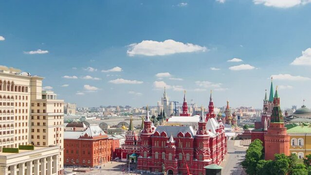 View of Manezh Square, Hotel Moscow, historical Museum and Kremlin aerial timelapse at cloudy summer day from rooftop in Moscow, Russia.