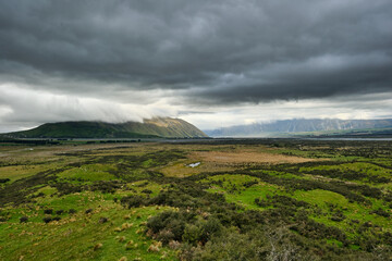 storm clouds over the mountain in new zealand