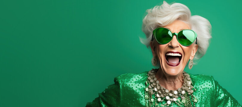 Happy Laughing Old Lady with Sunglasses Celebrating St Patricks Day on a Green background
