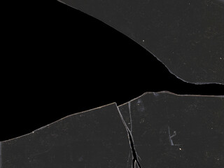 Texture of broken glass fragments with scratches and black background space for mockups for Y2K...
