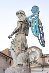 one of the statues on the bridge of sant angelo towards the castle of the same name