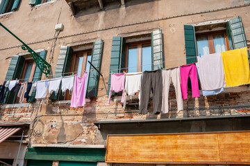 Venetian facade with drying clothes. Italy