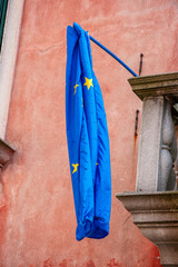 European Union flag hanging down on a flagstaff