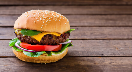 Vegan burger with vegetables on wooden rustic table. Healthy food concept.