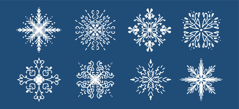 Beautiful set of white snowflakes on a blue background for winter design. Collection of Christmas and New Year elements. Frozen silhouettes of crystal snowflakes.