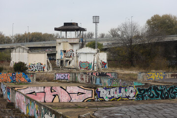 Fototapeta na wymiar abandoned buildings, graffiti and murals, tram the city of Belgrade