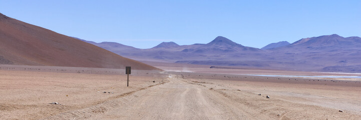 Bolivia, Salvador Dali Desert. Avoroa Nationa Park,  A road leading through the desert towards the...