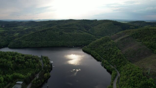 Slapy Reservoir is dam on the Vltava river in the Czech Republic, near to village Slapy. It has a hydroeletrics power station included.Aerial panorama landscape photo view	
