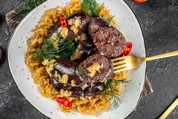 spanish sausage, blood sausage with sauerkraut. Food recipe background. Close up