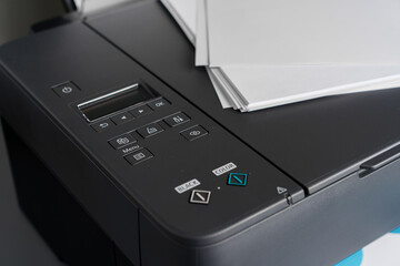 Close up of modern printer in the office