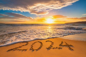 Zelfklevend Fotobehang Sea sunrise of first new day for 2024 year text on beach sand © ValentinValkov