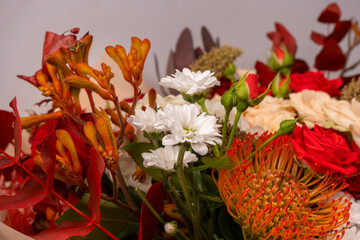 Autumn bouquet of red and white roses, hydrangeas, chrysanthemums as a background.