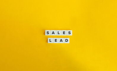 Sales Lead Term on Block Letter Tiles on Yellow Background. Minimalist Aesthetics.