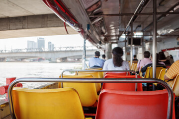Selective focus at seat on passenger boat on Chao Phraya river in Bangkok, Thailand. 