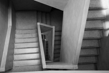 Black and white, Top diminishing perspective view of simple modern concrete staircase. 