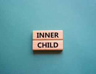 Inner Child symbol. Wooden blocks with words Inner Child. Beautiful grey green background. Business and Inner Child concept. Copy space.