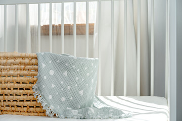 Nursery interior and bedding for kids with wicker bassinet