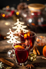 Delicious mulled wine with spices and oranges, Traditional hot drink at Christmas