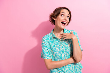Photo of lovely astonished lady open mouth look interested empty space isolated on pink color...