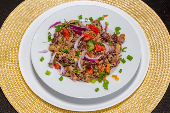 Typical rustic Brazilian dish, known as "arrumadinho" made with green beans, dried beef jerky, chili pepper, cassava flour, coriander
