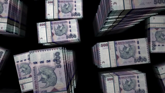 Tanzania money Tanzanian shilling money pack loop. Flight over TZS banknotes stacks top view. 3d loopable seamless animation. Abstract background concept of economy, crisis, business and finance.