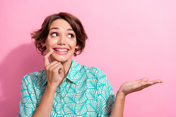 Portrait of nice cheerful lady finger touch chin toothy smile look hand demonstrate empty space...