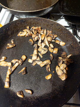 mushrooms fiying in a fiying pan