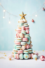 Sweet macaroons arranged in a Christmas tree with a star on the top. Colorful macarons dessert representing a Christmas tree.