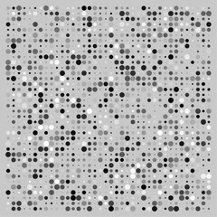 Random circle pattern on a grey backgroound also random in size and black and white color