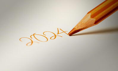 2024 being written on a white page by a dark orange pencil.