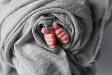 twisted child. Soft feet of a newborn	
