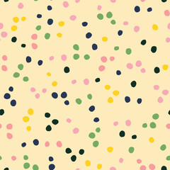 Multicolored polka dot seamless repeat pattern. Random placed, vector round minimal all over surface print on yellow background.