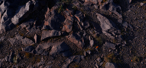 Stone background , Above is a full shot of a textured rough gray stony surface
